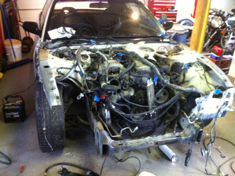 Upper radiator support and fender well removed.